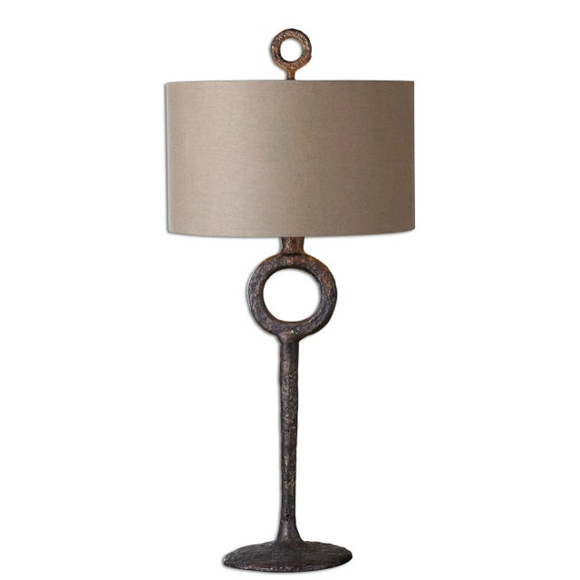 Hammered Cast Iron Finished In An Aged Rust Bronze. The Round Hardback Drum Shade Is A Rust Beige Linen Fabric.