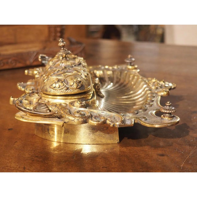 This piece of nineteenth-century French elegance is sure to be the envy of any collector. The Napoleon III gilt bronze...
