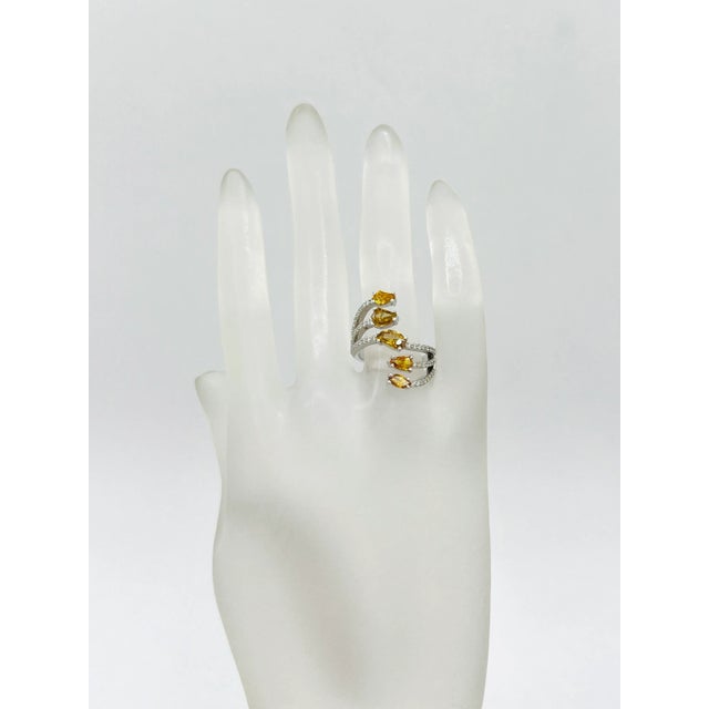 Beautiful 1.48 ct. orangey yellow multi shape diamonds with 0.39 ct. good quality white diamond rounds. Handmade in 18k...