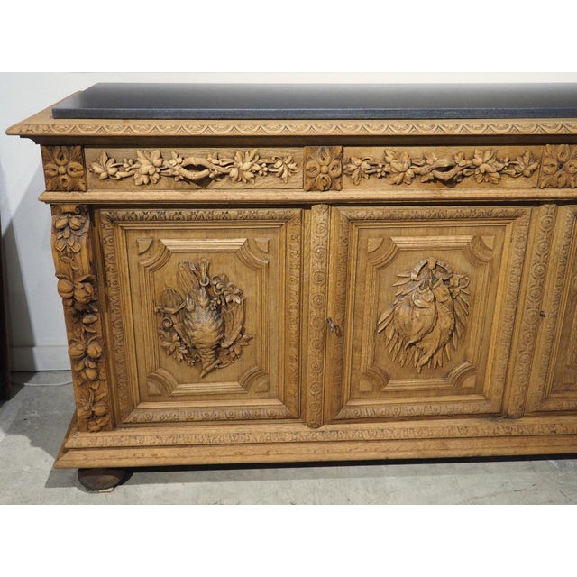 More information coming soon… Hand-carved in oak circa 1880, this French hunt buffet has a speckled black granite top that...