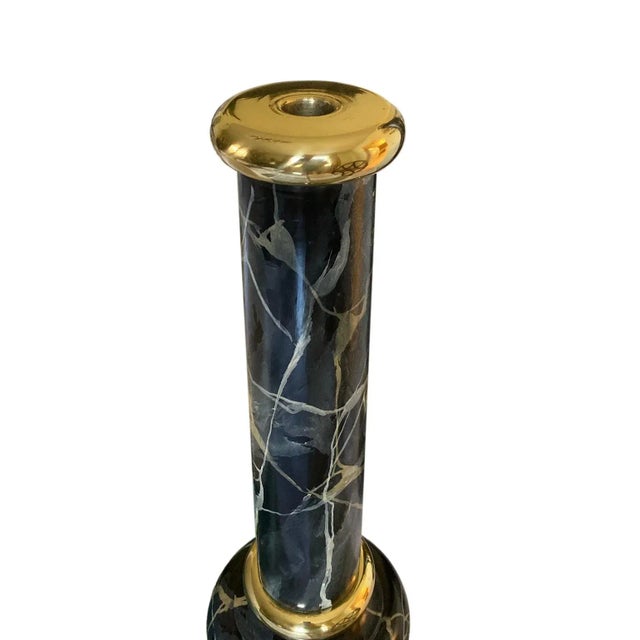 Set of 2 dramatic large candle sticks for taper candles with a hand painted marbleized finish and brass trim. In the style...