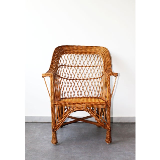 Rattan armchair in perfect condition. A beautiful piece for charming decor.