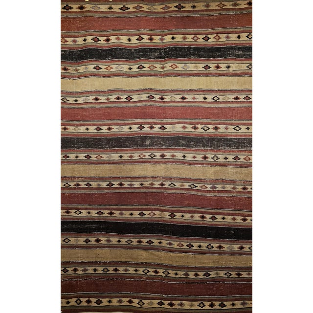 This early 1900s Persian Shahsavan Kilim is a rare and beautifully preserved textile, handwoven in a wide-band pattern...