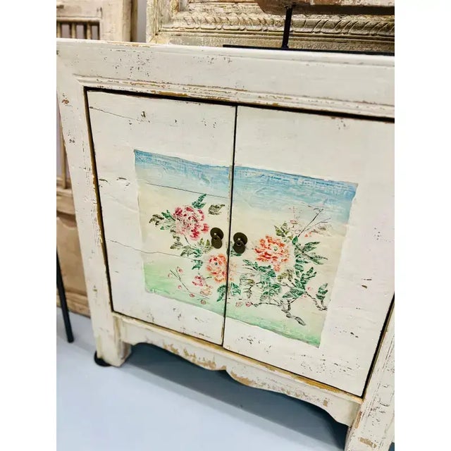 One-of-a-kind antique vintage hand painted Asian sideboard cabinet with handpainted florals. The ancestral technique uses...