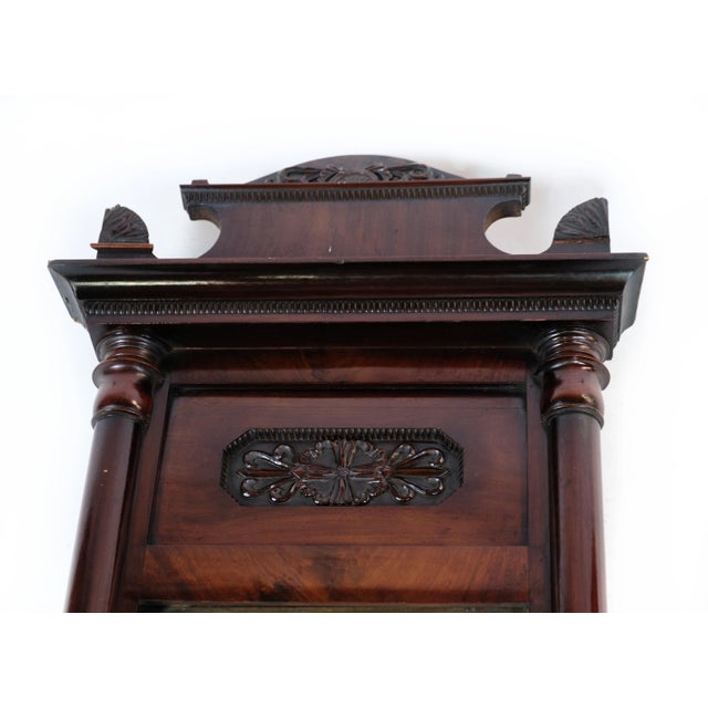 Antique mirror in mahogany wood from the late Empire period from around the 1840s. Dimensions in cm: H:127 W:53