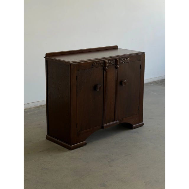 W48 D19.75 H39.5 Fully restored art deco sideboard that features details like the circular wooden pull handles on each...
