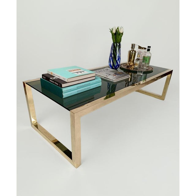 A Very Large coffee table, 150cm wide by 61cm of deep; Certainly handcrafted in Italy during the 70s. This vintage Coffe...