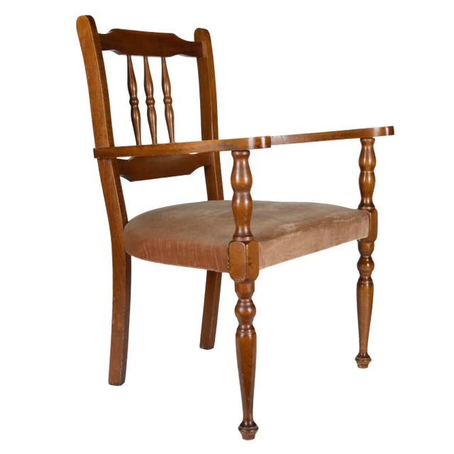 This Italian armchair comes with a champagne-colored velvet upholstered seat and dates from the 1960s.