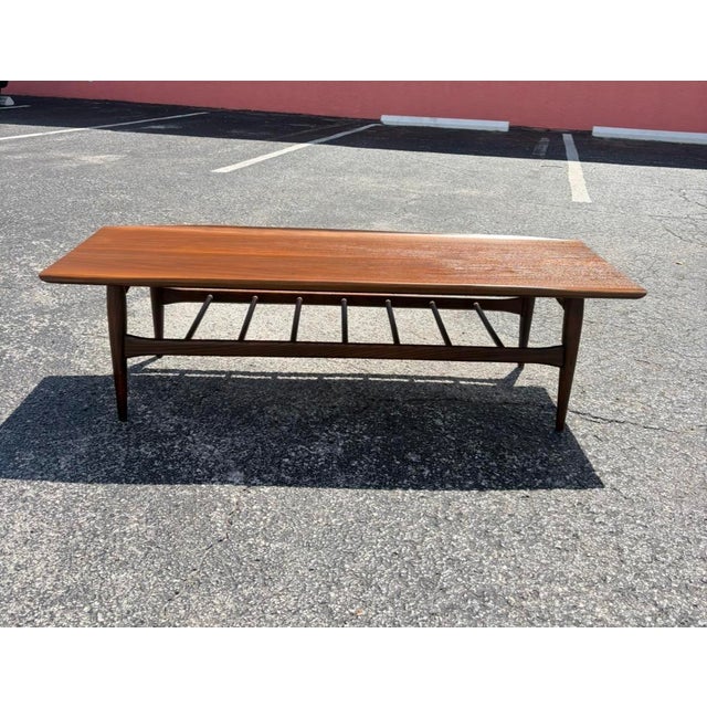 The timeless design of a mid century surfboard coffee table never goes out of style. This Bassett Artisan is a great table...