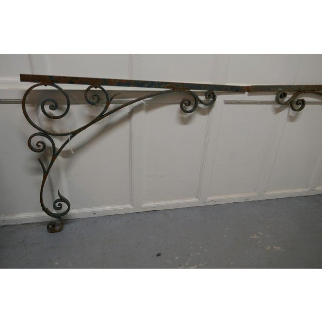 A pair of 19th century French wrought iron gate post corners. A lovely large pair of wrought iron corner brackets, these...