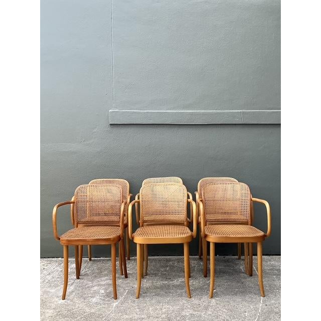 This exceptional set of six vintage Stendig bentwood armchairs is a masterclass in Mid-Century Modern design, drawing...