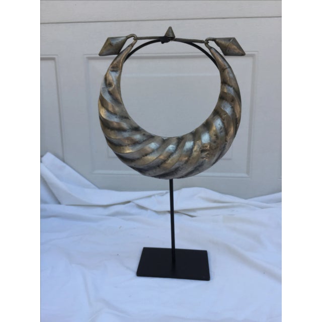 A vintage tribal silver metal necklace on black metal stand. Made by the Yao hill tribe of Hunan province. Necklace...