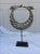 A vintage tribal silver metal necklace on black metal stand. Made by the Yao hill tribe of Hunan province. Necklace...