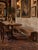 An antique country bench distinguished by its long, beautifully proportioned plank seat, deep apron, and sculptural...