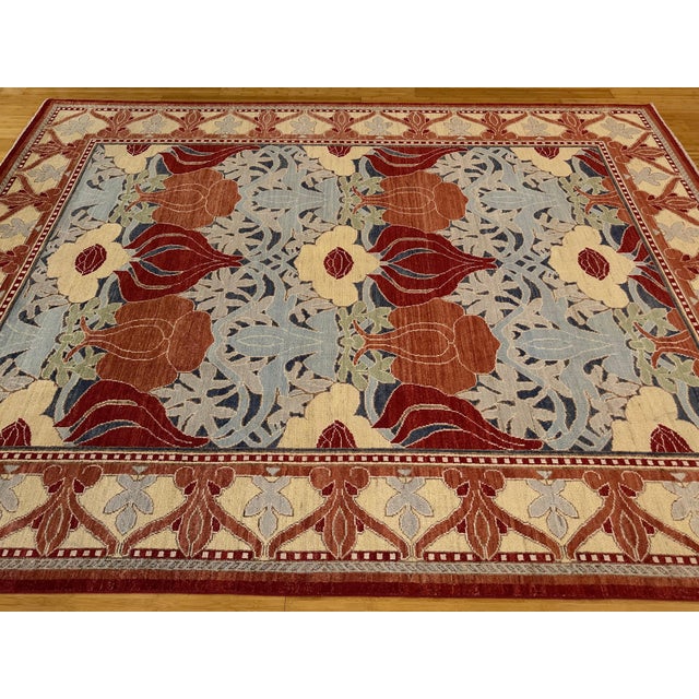 This unique hand-knotted wool rug from Afghanistan is inspired by the legendary William Morris Arts & Crafts movement....
