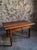 Antique French walnut dining table dating from circa 1900. The table has a rectangular top made from several wide walnut...