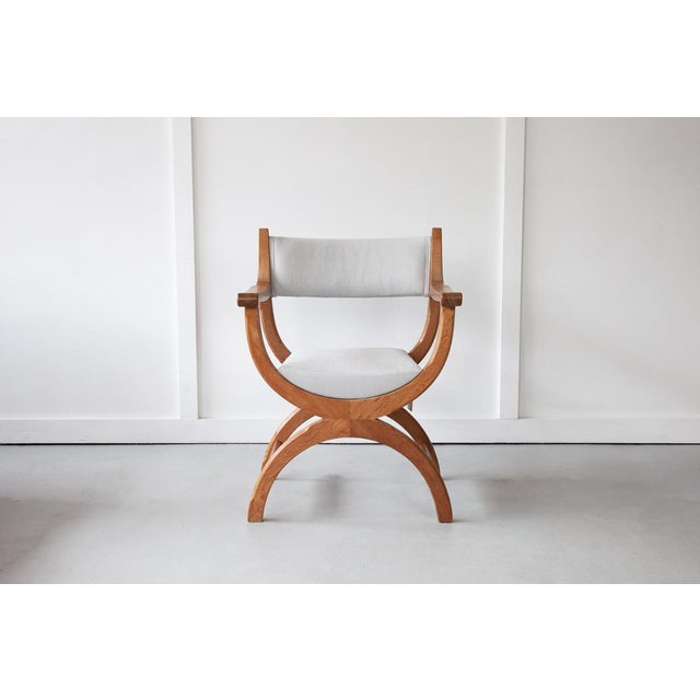The 'Kurul' Armchair, designed by Henning Kjærnulf for EG Kvalitetsmøbel. Sculpted out of solid oak, with a carved,...