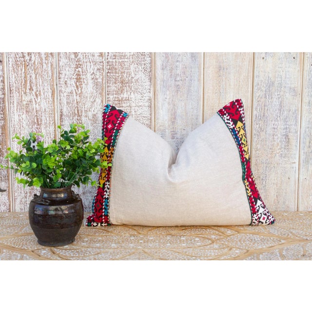 This linen pillow is flanked by rare antique tribal borders, it is bordered by hand-woven, ply-split camel girth lace and...