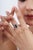 This elegant halo ring features a striking 3.31-carat emerald-cut blue sapphire, set in 14K yellow gold. The center stone...