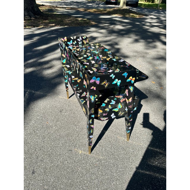 Beautiful "butterfly" desk, originally designed by Gio Ponti in 1954 and decorated by Fornasetti. Fornasetti label stamped...