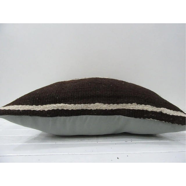 This is a pillow cover made from a vintage kilim rug. The piece was properly washed and ready to use. Pillow inserts not...