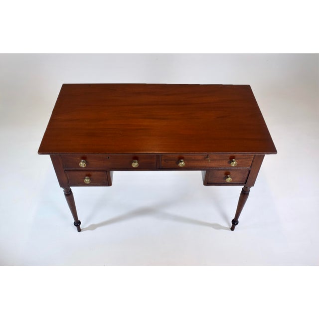 19th C. solid Mahogany writing desk table. Features four dovetail, cockbeaded drawers fitted with original brass knobs...