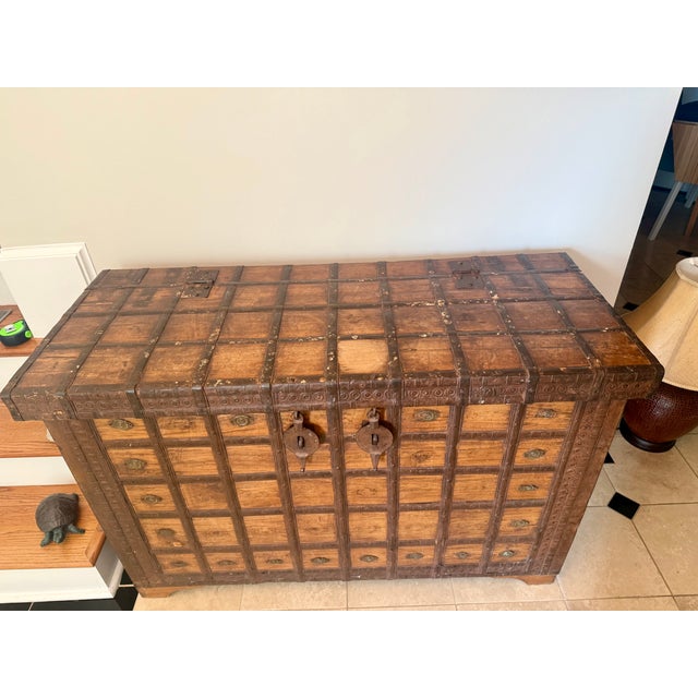 Distinctive vintage/antique Indian storage chest. Beautiful and substantial piece used as an entryway console table....