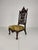 This is a beautifully crafted 19th-century Black Forest-style armchair, richly carved with grapevine and leaf motifs....