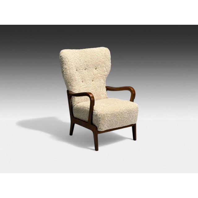 Danish Mid-Century Modern, Beige Shearling, Beech, Lounge Chair, Denmark, 1960s Danish modern high back lounge chair with...