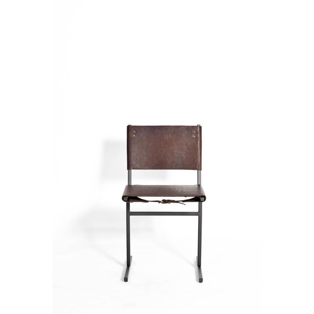 Chocolate and black memento chair, jesse sanderson original signed chair by jesse sanderson materials: leather, steel...
