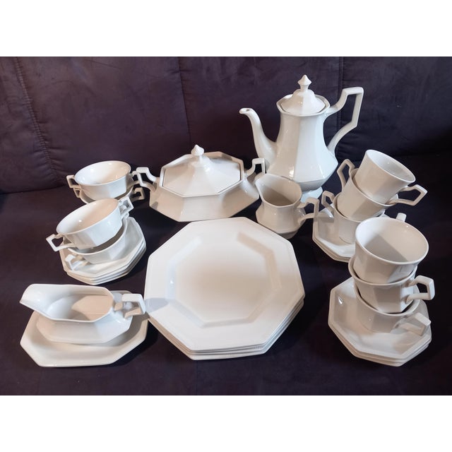 White, octagonal porcelain coffee and dinner service, vintage Heritage White pattern by Johnson Brothers. It includes 6...