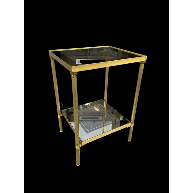 70s brass table with double top in smoked glass and mirror original condition and patina.