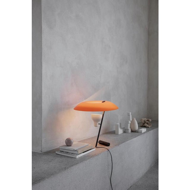 Model 548 design by gino sarfatti the table lamp designed in 1951 is a study in balance and light reflection through a...