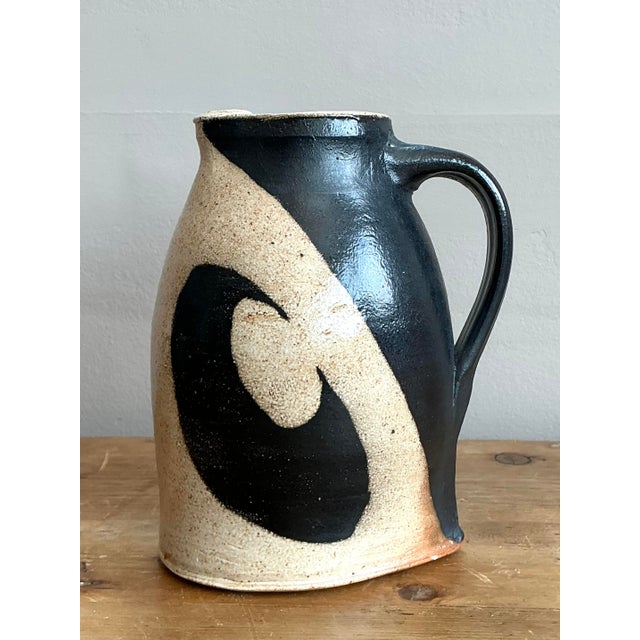 This striking original studio pottery pitcher is a masterclass in Modernist graphic design and organic form. Hand-crafted...