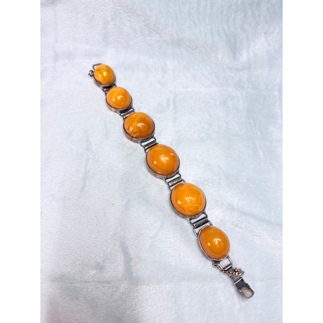 Beautiful vintage Polish Baltic amber bracelet featuring six large egg yolk butterscotch amber cabochons set in...