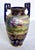 Nippon porcelain was created in Japan prior to 1921. This lovely vase features a hand painted landscape with a house and...
