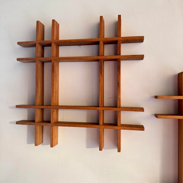 These wooden objects once hung in a garden as a decorative object. They were stringed together sort of like a triple bunk...