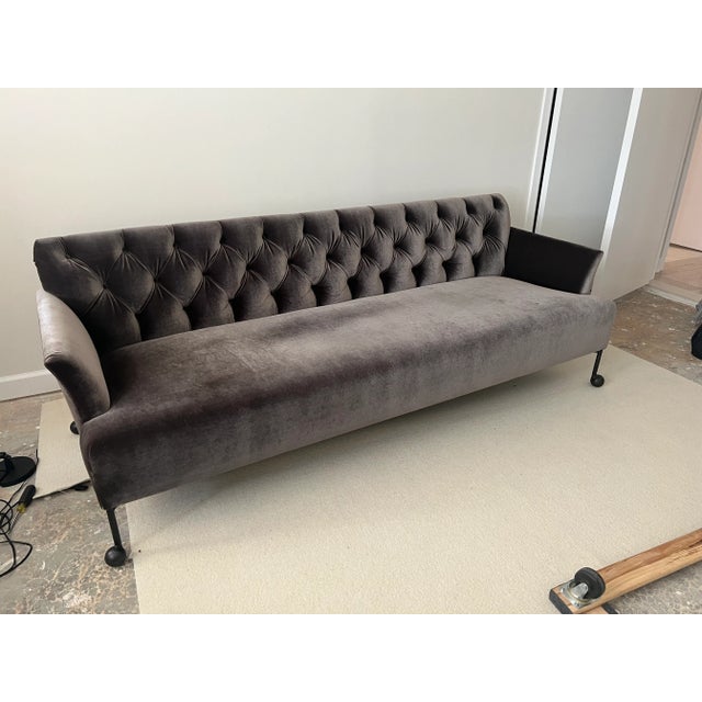 Timeless custom tufted sofa with iron metal legs. Perfect for a modern home. Sofa features integral seat cushion and...