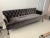 Timeless custom tufted sofa with iron metal legs. Perfect for a modern home. Sofa features integral seat cushion and...