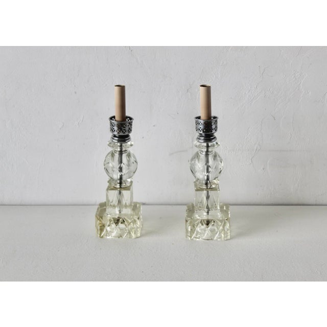 Vintage Art Deco-inspired cut glass boudoir lamps featuring a stacked geometric and sphere crystal design with a...