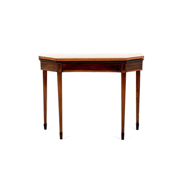 A grand george iii mahogany card table with satinwood banding throughout. The hinged top opens and effortlessly swings...
