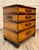 A distinctive vintage British Colonial-style four-drawer chest, believed to date to the later 20th century, featuring a...