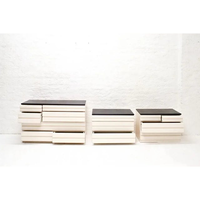 - set of three commodes designed by vico magistretti for poggi - from the samarcanda series - the upper panels are covered...