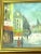 A charming pair of 1950s Paris street scene oil paintings capturing the romantic atmosphere of mid-century European city...