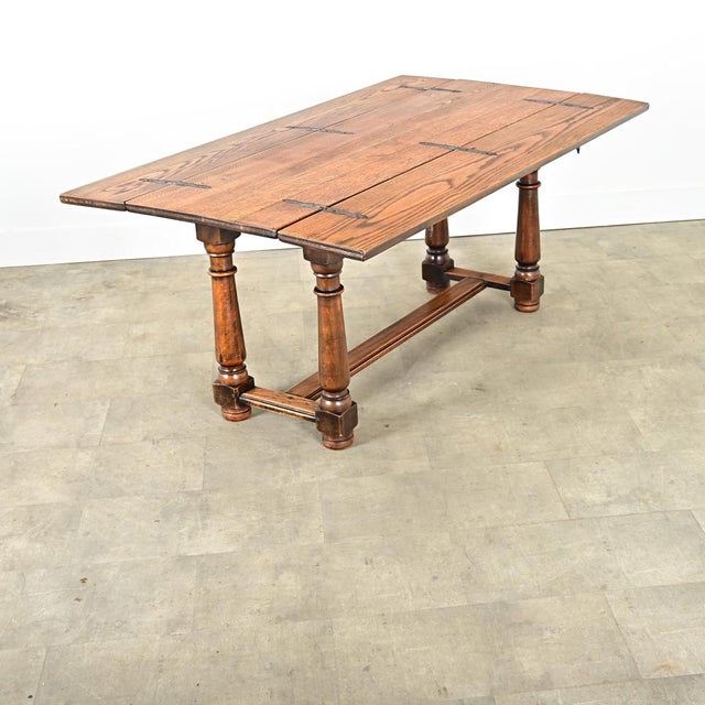 Dimensions: 30” H x 67” W x 39 ¼” D A rare, metamorphic oak table from 18th century France, appearing to be a substantial...