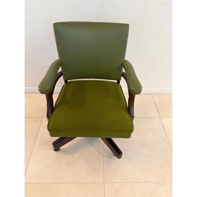 Bring vintage sophistication and everyday function to your workspace with this Mid-Century executive desk chair. Featuring...