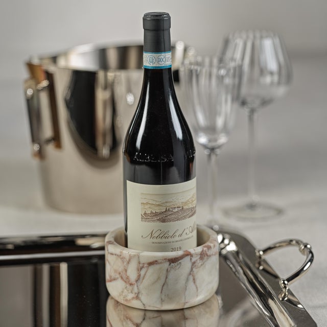 Show case your wine bottle in style and protect your table from drips with this elegant entertaining piece. Our marble...