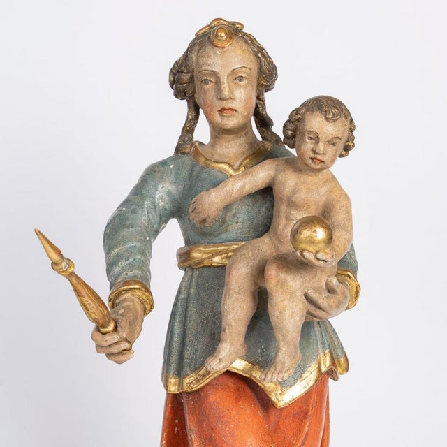 Virgin and Child in polychrome linden wood, Germany, 18th century. Carved and polychrome wooden sculpture depicting the...