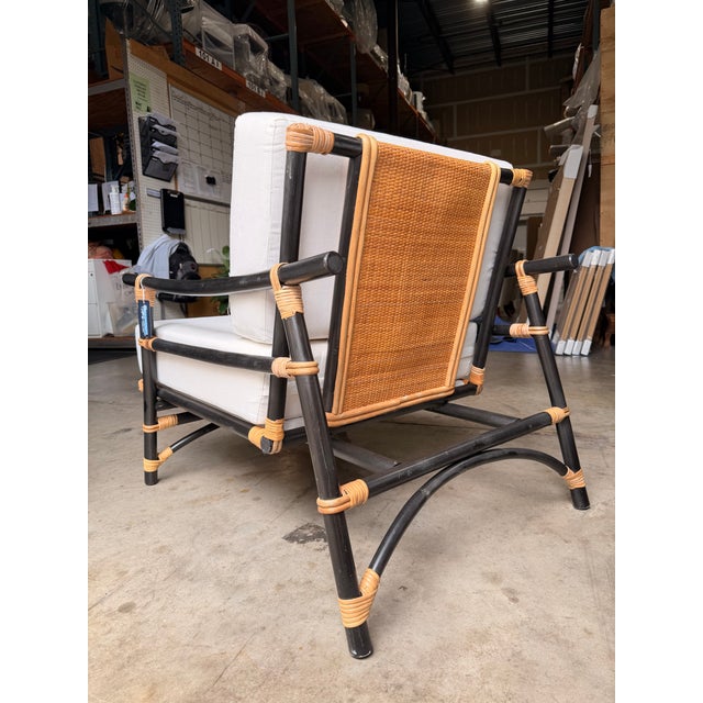 Bring relaxed coastal style to any space with this elegant lounge chair featuring an off-white linen-like polyester...