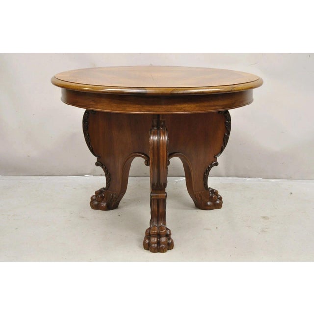 Antique German Renaissance Revival Carved Walnut Paw Feet Round Center Table. Item features a tripod base with carved paw...